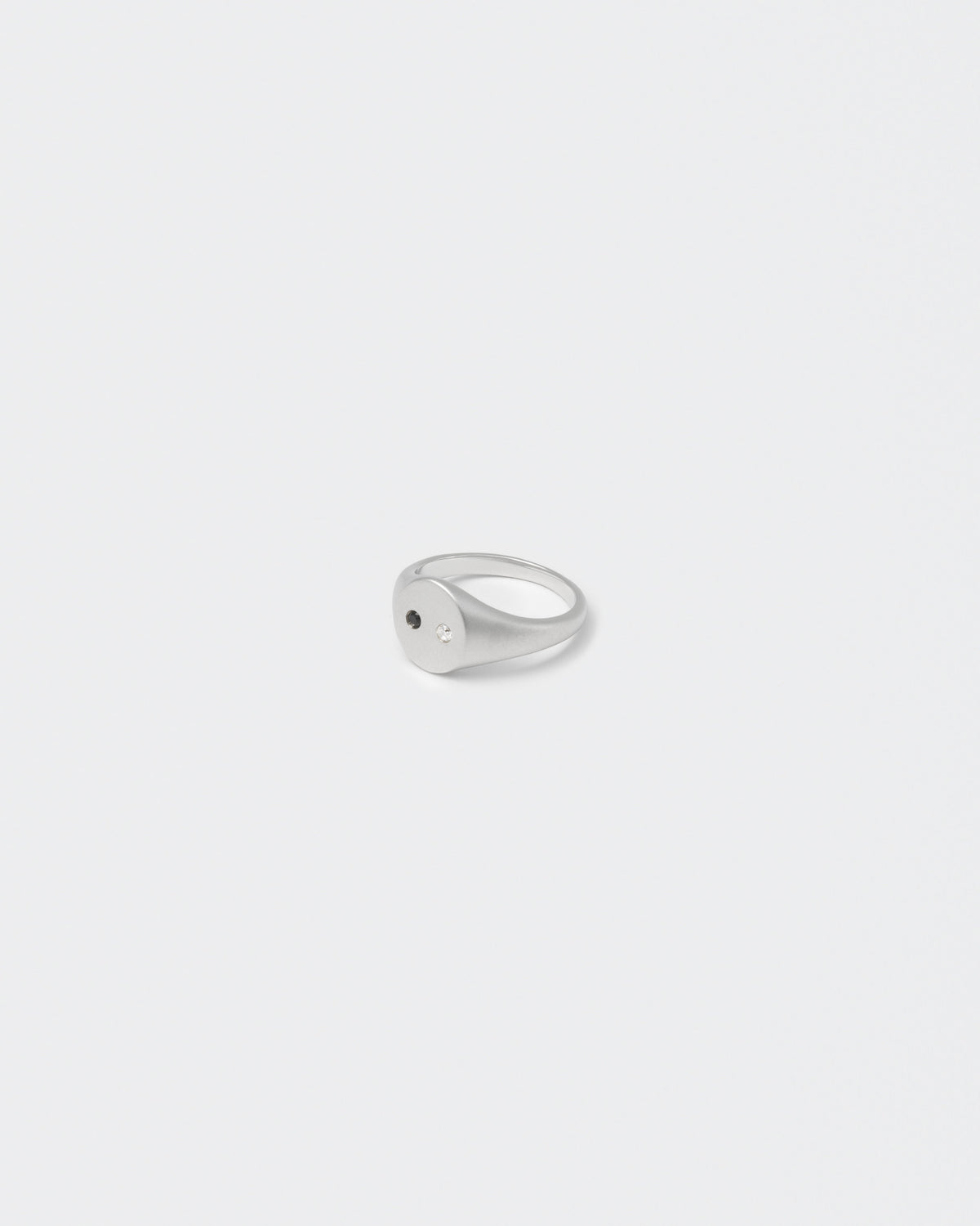white gold satined ring with hand-set stones in white and black for man and women
