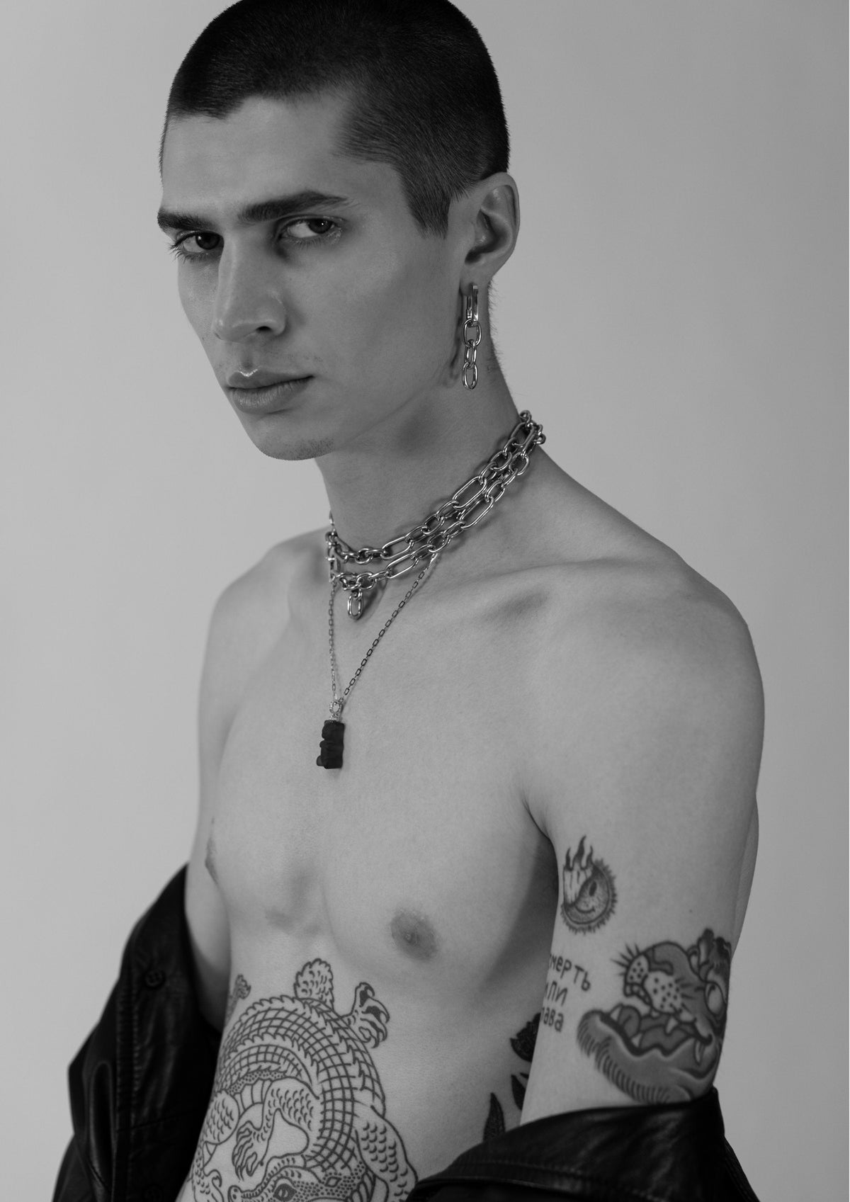 DARKAI Raw Energy Lookbook SS22 Man wearing gemmy bear and gold chain necklace