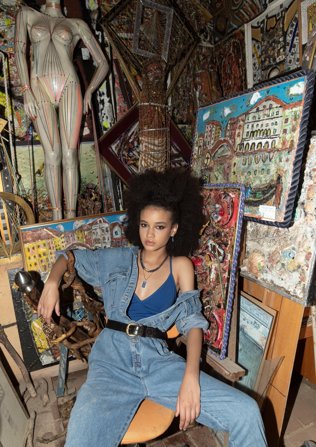 DARKAI Raw Energy Lookbook SS22 Woman in art studio wearing gold chain necklaces