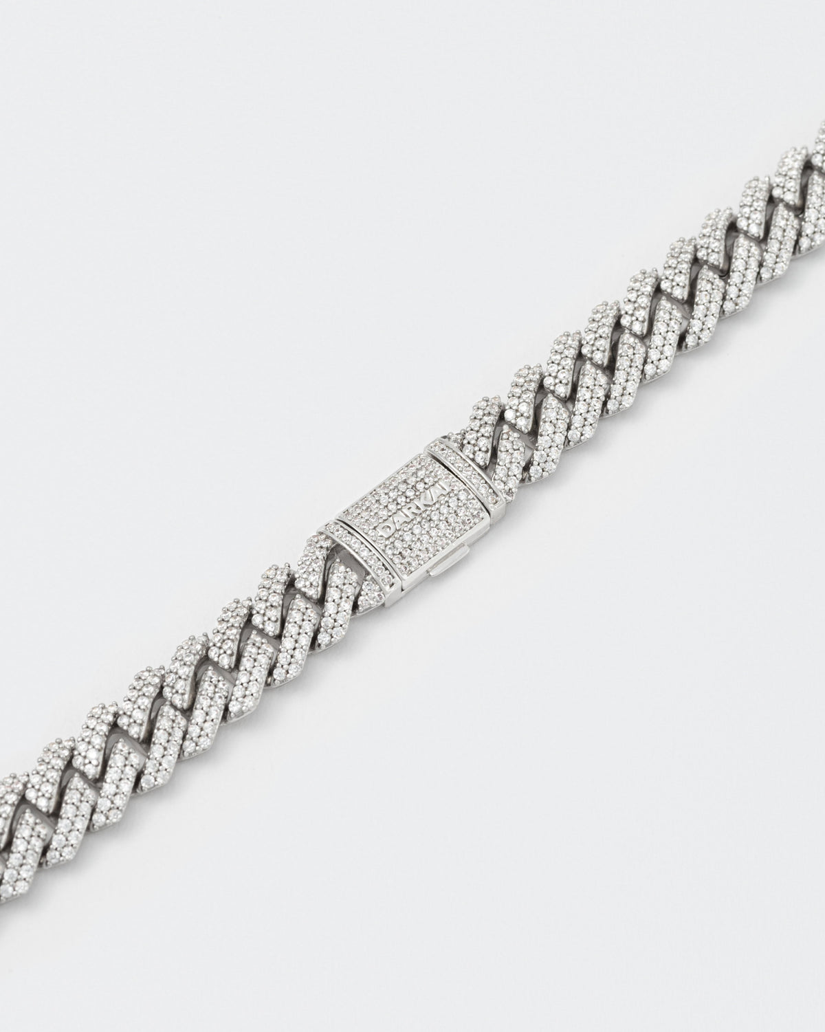 detail of clasp of 18k white gold coated mini prong chain necklace with hand-set micropavé stones in white