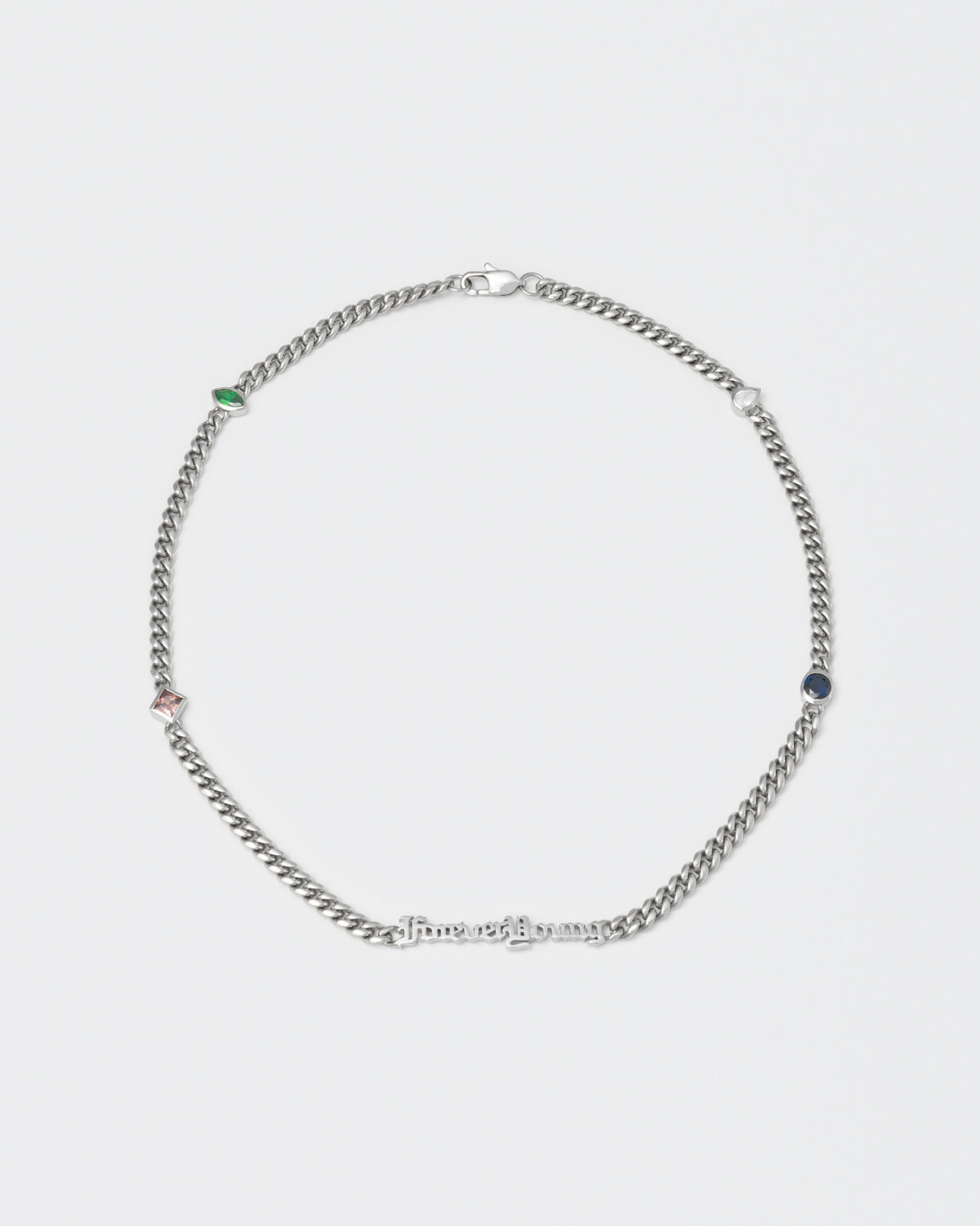 Forever Young cuban chain necklace with 18kt white gold coating, mixed shape bezel stones in diamond white, burna blue, green, chocolate and "Forever Young" central metal tag